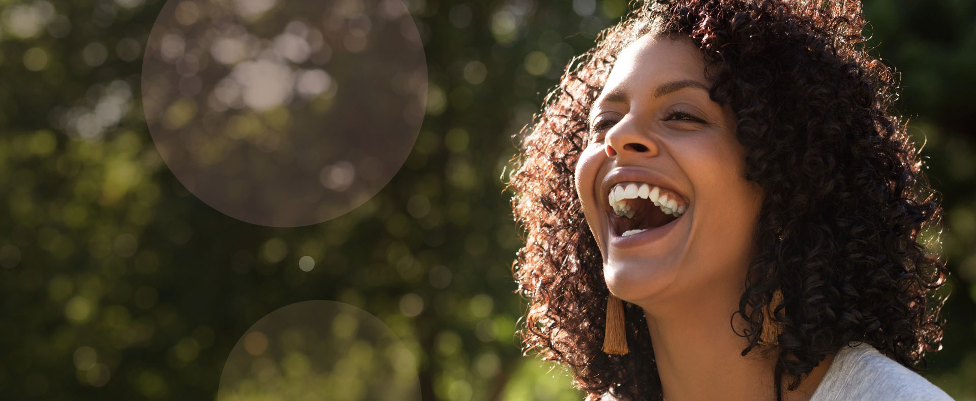 Woman with big smile on sunny day