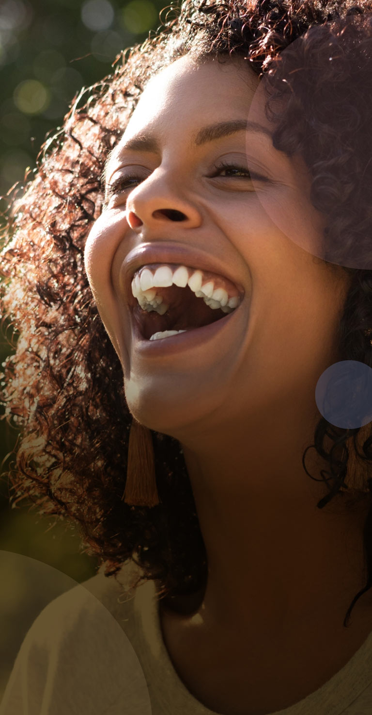Woman with big smile on sunny day mobile